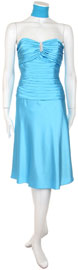 item 26132. Strapless Bust Gathered Front Pleged Cockail Dress. Short satin shirred waist dress with emphasis on waist and bust. Mid-bust accentuated with silver broach. Dress made of glitzy satin fabric.